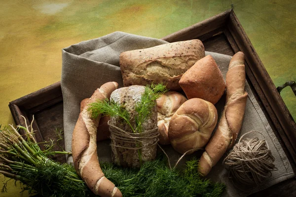 French buns variety of wheat with green dill — Stock Photo, Image