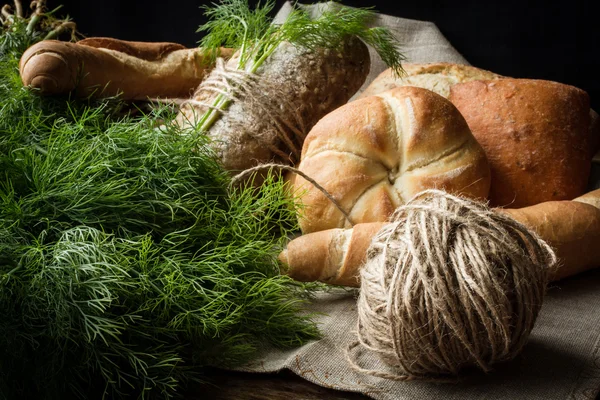 French buns variety of wheat with green dill — Stock Photo, Image