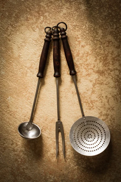 Old vintage ladle and fork for meat — Stock Photo, Image