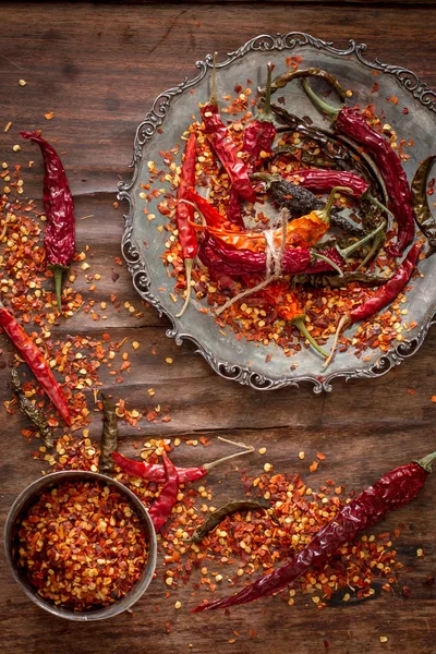 Dry  chili pepper on a wooden background Stock Picture