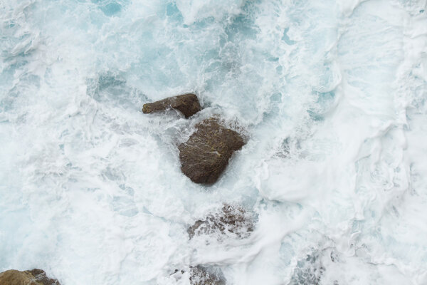 beating the rock sea wave. extreme sports