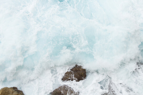 beating the rock sea wave. extreme sports