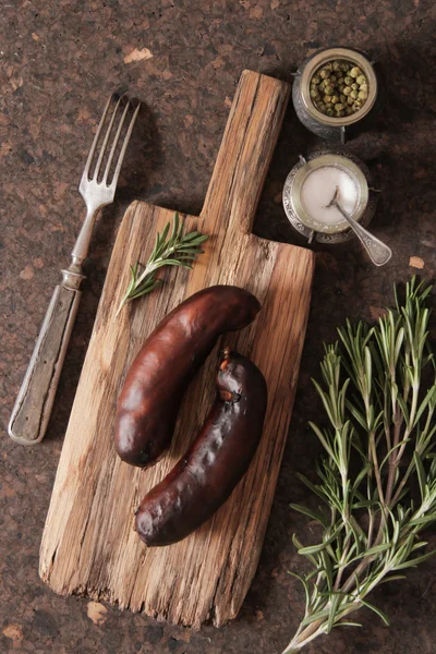 Bratwurst grill with salt and pepper and rosemary — Stock Photo, Image