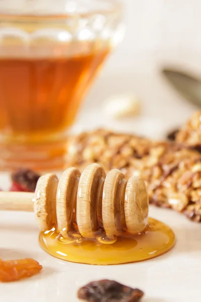 Bar of delicious muesli with honey and nuts — Stock Photo, Image