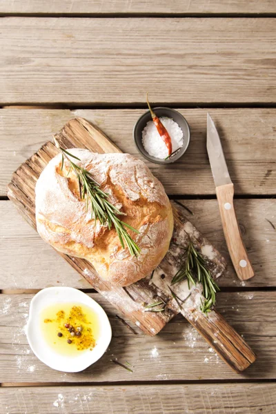 Fresh bread with salt and a delicious olive oil — Stock Photo, Image