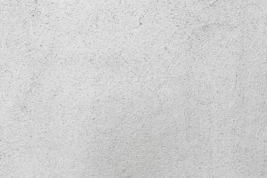 Beton duvara pankart yerleştirmek için kullanılan eski bir duvar gibi doğal çimento veya taş dokunun beyaz beton dokusu..