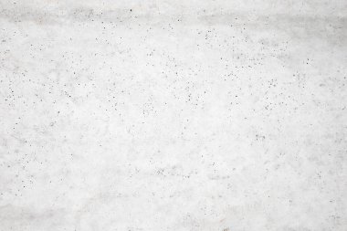 Beton duvara pankart yerleştirmek için kullanılan eski bir duvar gibi doğal çimento veya taş dokunun beyaz beton dokusu..