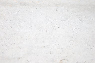 Beton duvara pankart yerleştirmek için kullanılan eski bir duvar gibi doğal çimento veya taş dokunun beyaz beton dokusu..