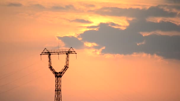 Time lapse with transmission tower and cumulus clouds at dawn — Stock Video