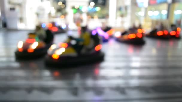 Blurred motion of people driving bumper cars — Stock Video