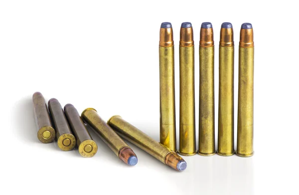 Large rifle bullets on white background — Stock Photo, Image