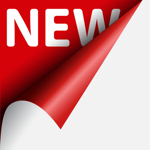 Curled corner of red paper