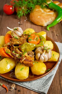 Slow-cooked stew with tender lamb meat, potatoes and vegetables clipart
