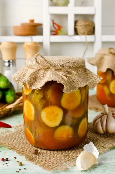 Spicy cucumbers with garlic in tomato marinade — Stock Photo, Image