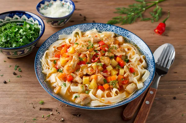 Uzbek lagman soup with noodles, meat and vegetables. Traditional Uzbek cuisine. — Stock Image Uzbek Lagman Soup Noodles Meat Vegetables Traditional Uzbek Cuisine Royalty Free Stock Photos