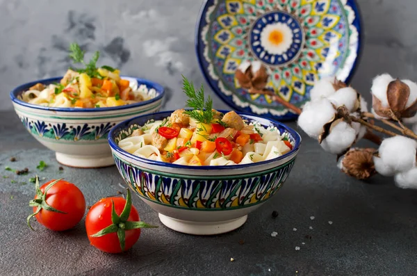 Uzbek lagman soup with noodles, meat and vegetables. Traditional Uzbek cuisine. — Stock Image Uzbek Lagman Soup Noodles Meat Vegetables Traditional Uzbek Cuisine Royalty Free Stock Images