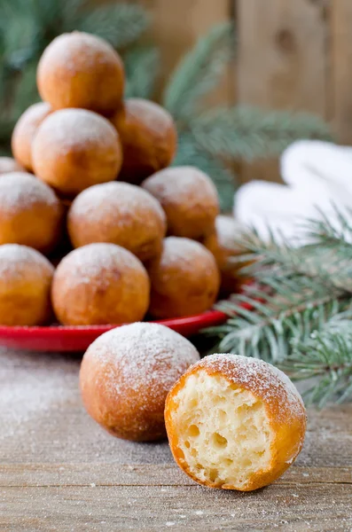 Christmas donuts with powdered sugar with fir branch — Stock Photo, Image