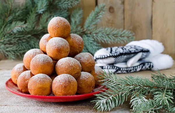 Christmas donuts with powdered sugar with fir branch — Stock Photo, Image