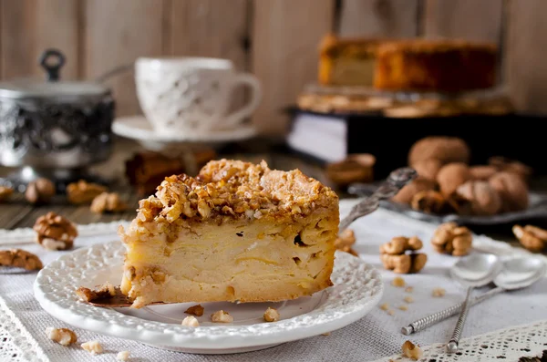 Piece of apple pie with walnut and sugar glaze — Stock Photo, Image