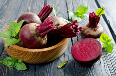 Young beets in a wooden bowl clipart
