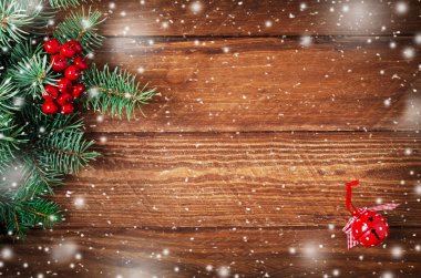 Jingle el çan ahşap kar arka plan üzerinde