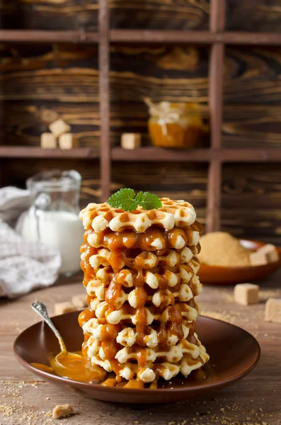 Belgian sugar waffles with caramel sauce — Stock Photo, Image