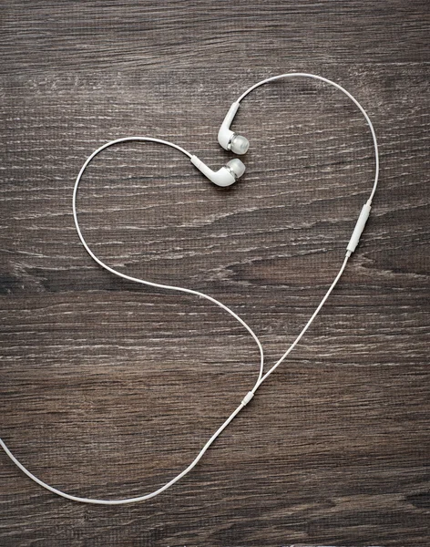 Hou van muziek. Hoofdtelefoon draden in de vorm van hart Stockafbeelding