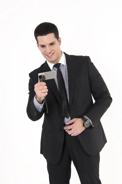 Businessman taking pictures with cellular phone — Stock Photo, Image