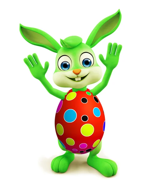 Easter Bunny met kleurrijke eieren zeggen hi pose Stockfoto
