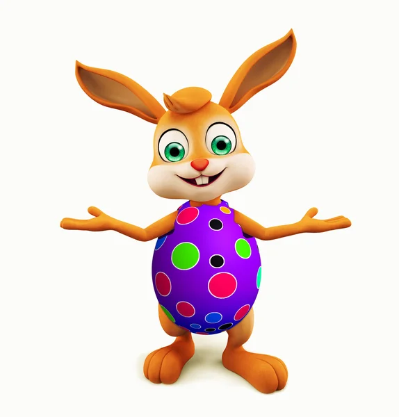 Paskalya tavşanı renkli yumurta sunu poza sahip — Stok fotoğraf