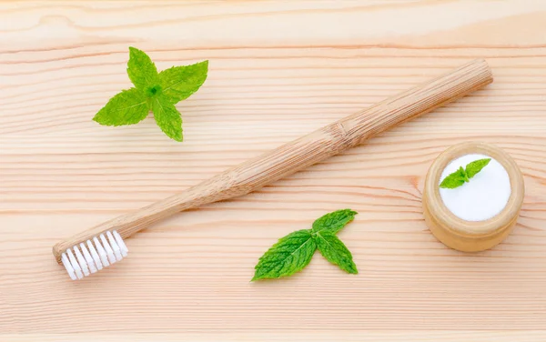 Alternative wood toothbrush and xylitol, soda, powder, salt, mint on wooden — Stock Photo, Image