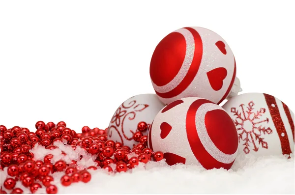 Christmas background with balls and red garlande in snow on white — Stock Photo, Image