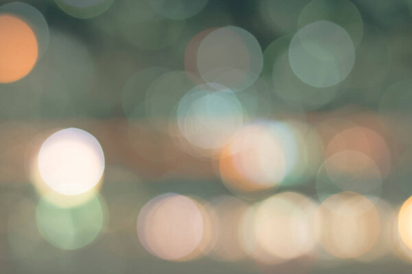 Blurred abstract background night city life downtown with candle lights bokeh