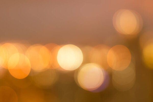 Blur background rooftop view of Bangkok downtown city lights skyline with colorful night bokeh