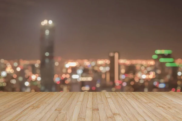 Wood floor terrace or wooden table with blur background rooftop perspective view city night light bokeh
