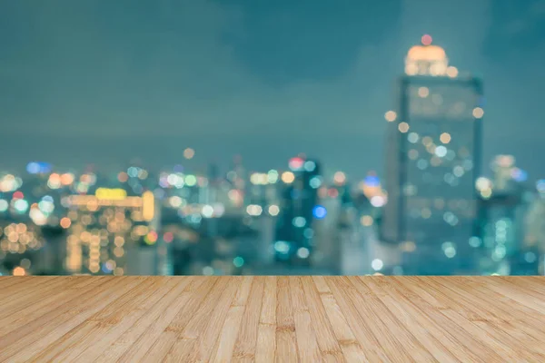 Wood floor terrace or wooden table with blur background rooftop perspective view city night light bokeh