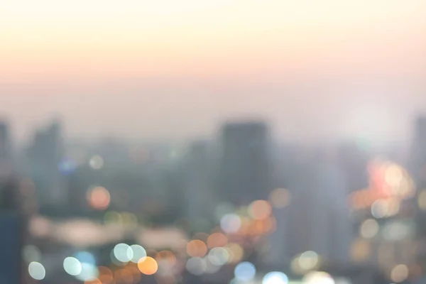 Blur city background rooftop view of cityscape business building landscape night lights bokeh