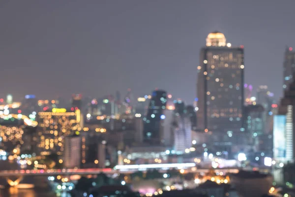 Blur city background rooftop view cityscape business building landscape night lights bokeh