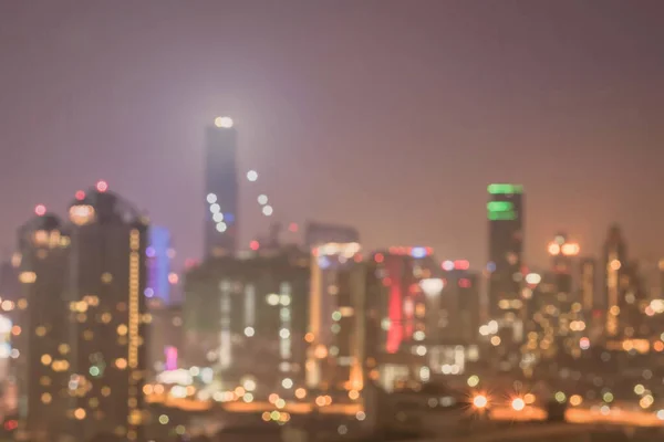 Blur city background rooftop view of Bangkok cityscape business building landscape night lights bokeh