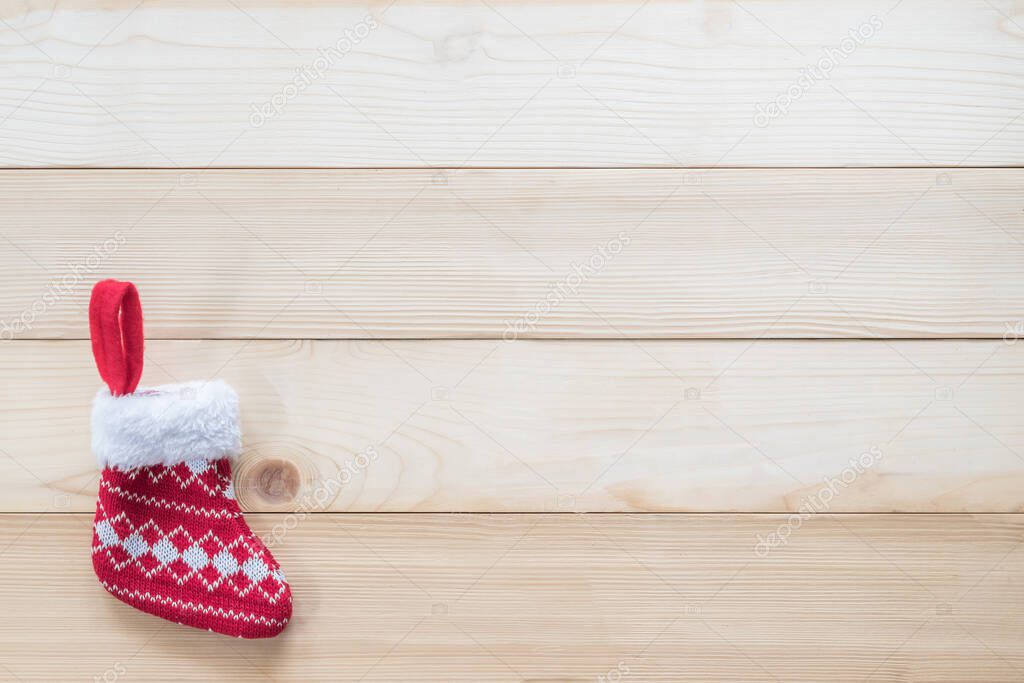 Christmas background with red baby sock xmas gift decoration on white pine wood table for boxing day, winter seasonal holiday and new year celebration