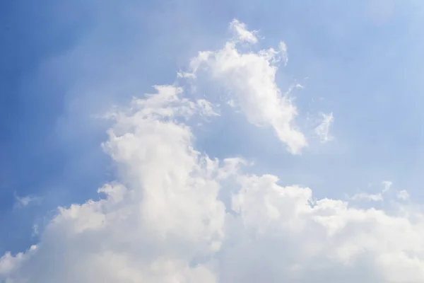 Sky with swan-head-shaped clouds