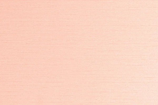 コットンシルク生地のテキスタイル壁紙詳細テクスチャパターンの背景に甘い光明るいピンクオレンジクリーム色 — ストック写真