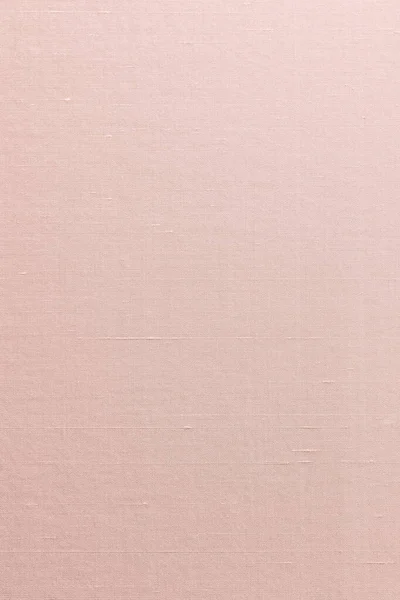 シルクコットンリネン混紡生地の質感の背景に薄い甘いオレンジ赤ピンク — ストック写真