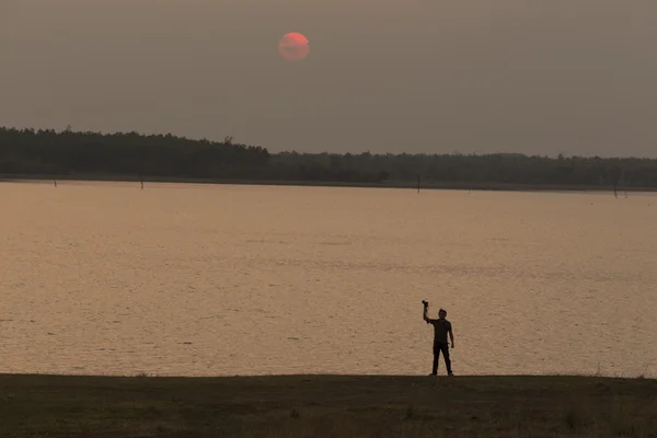 Fotógrafos com pôr do sol — Fotografia de Stock