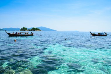 view to snorkeling a coral reef at Koh-Lipe island, thailand clipart