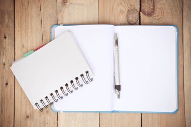 booklet and blue book on the wood 