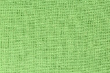 Parlak yeşil kumaş arka plan açık tuval dokusu ile  