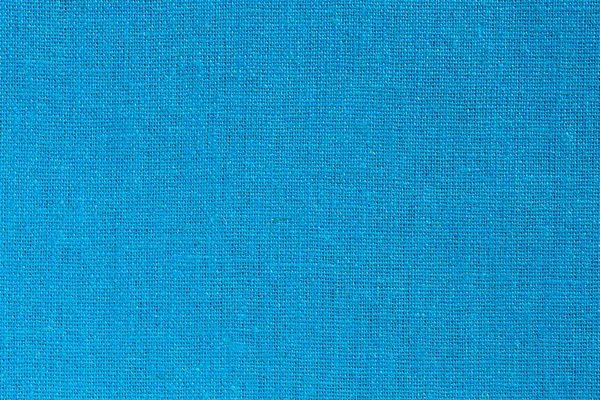Ljusblått tyg bakgrund på nära håll — Stockfoto