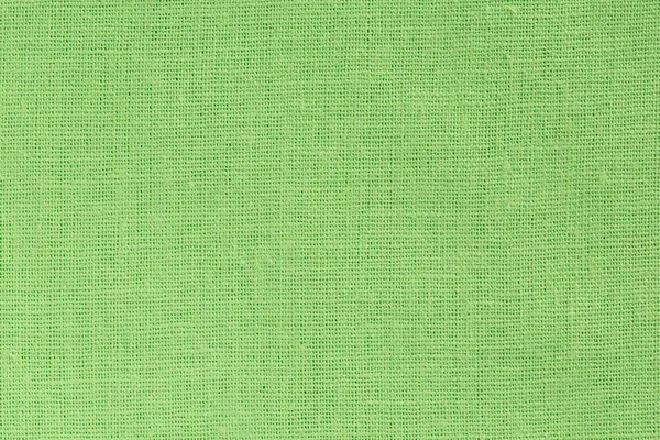 Fundo de tecido verde brilhante com textura clara de lona — Fotografia de Stock