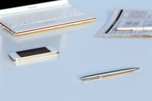 Angle View of Work Place with Laptop Pen and Newspaper — Stock Photo, Image